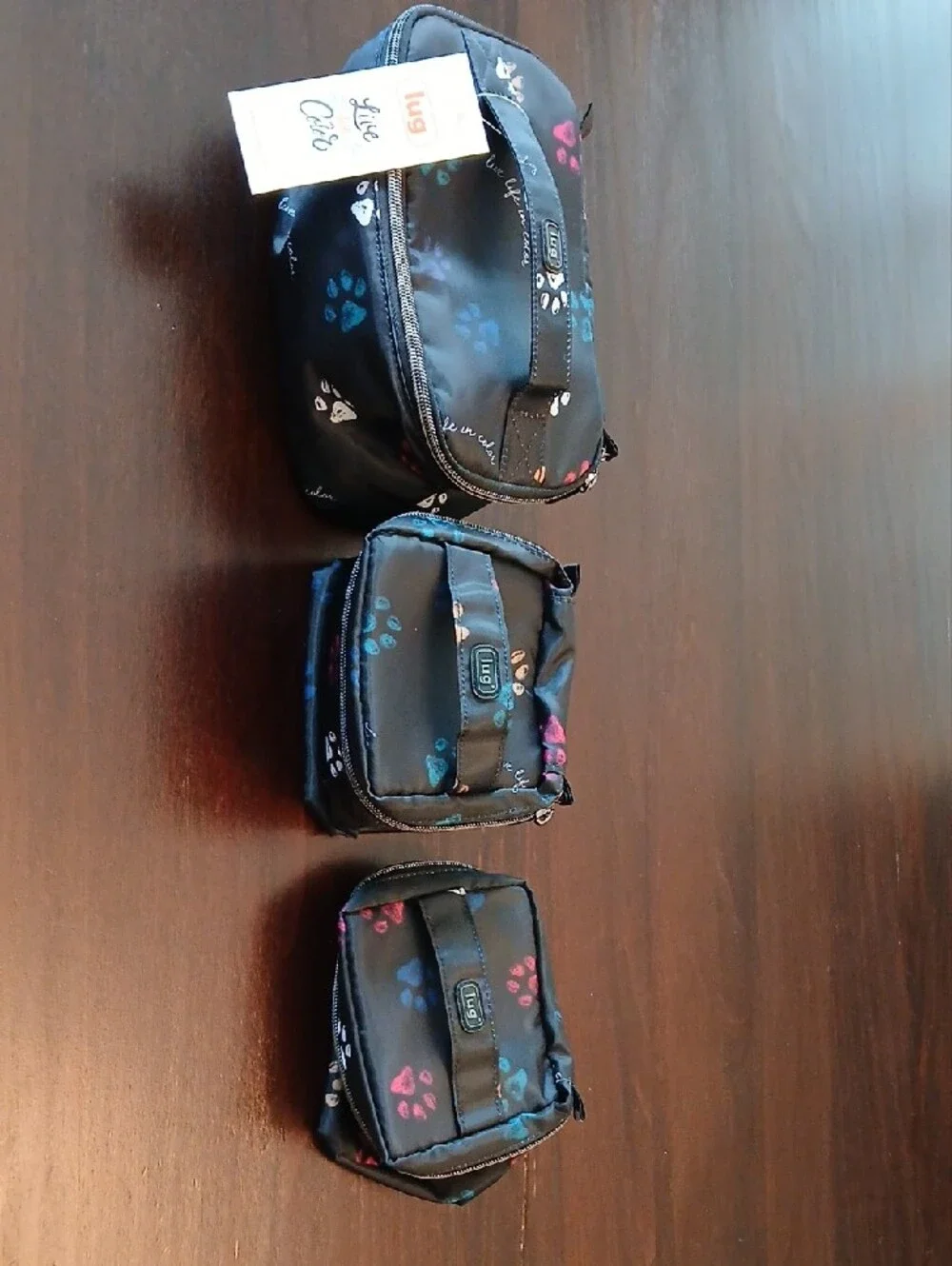 lug Black Cosmetic Case with Multicolor Paw Prints